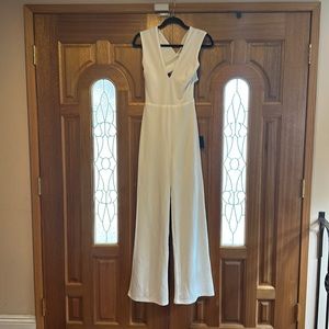 White jumpsuits. bought to many white things for my wedding. Never worn